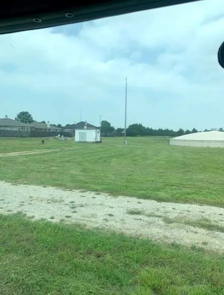 Freshly mowed vacant lot on a cloudy day